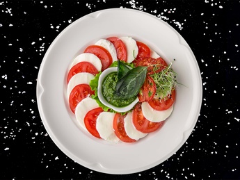 Mikado tomatoes with buffalo mozzarella and pesto sauce