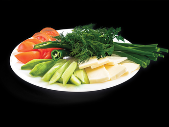 Assorted fresh vegetables and bryndza